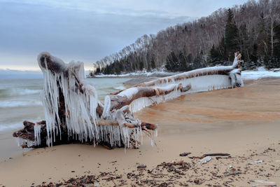 Panoramic view of beach against sky during winter