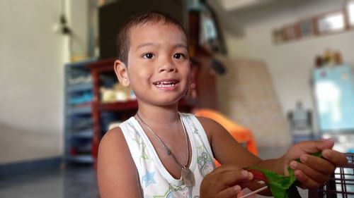 Portrait of smiling boy at home