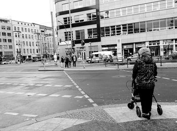 Woman standing on city street