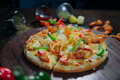 Close-up of pizza served on table