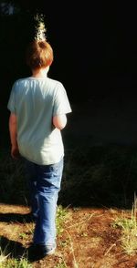 Woman standing on grassy field