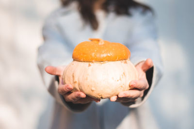 Close-up of hand holding ice cream