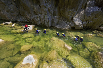 High angle view of people on rock formation