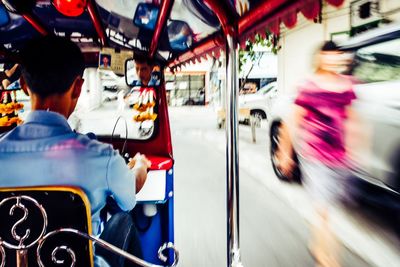 Blurred motion of people traveling in bus