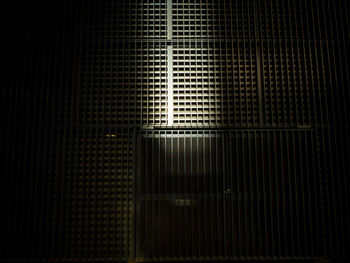 Full frame shot of illuminated metal grate