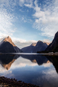 Scenic view of lake and mountains against sky