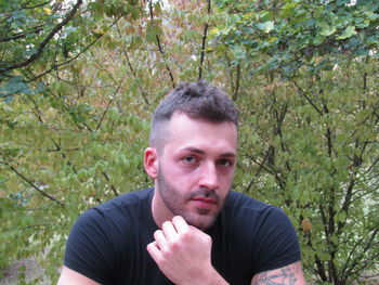 Portrait of young man in forest