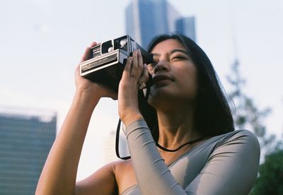 Portrait of woman using mobile phone