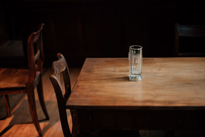 Empty drinking glass on table in restaurant