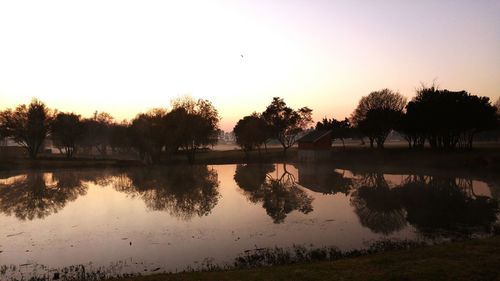 Scenic view of lake at sunset