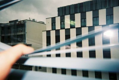 Cropped image of office building against sky