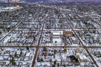 High angle view of city buildings during winter