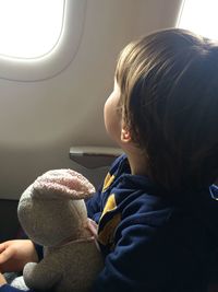 Close-up of young woman in airplane