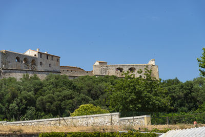 Low angle view of fort against blue sky