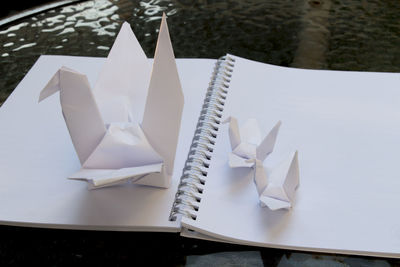 High angle view of origami papers on book