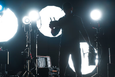 Low angle view of silhouette people at music concert