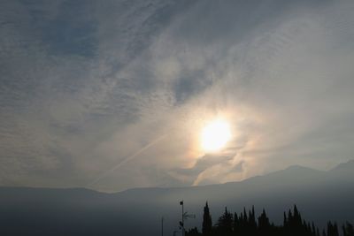 Scenic view of silhouette mountains against sky at sunset