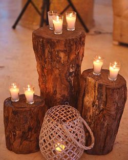 Close-up of illuminated candles on table