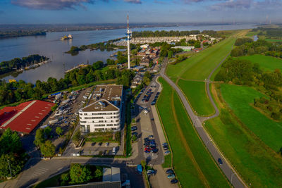 High angle view of trees and buildings in city