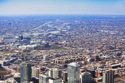 High angle view of city buildings against sky