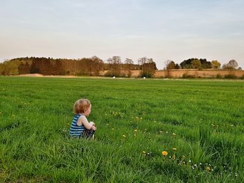 Girl on grassy field