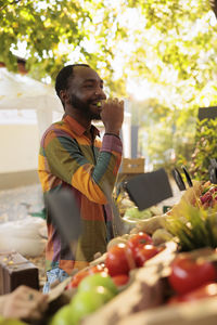 Side view of man drinking wine in restaurant