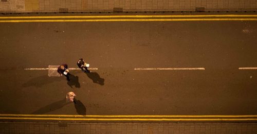 Men standing on the road