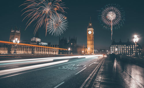 Firework display over city street