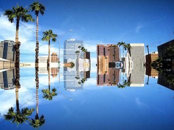 Low angle view of modern building against blue sky