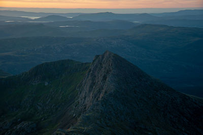 High angle view of mountains against sky during sunset