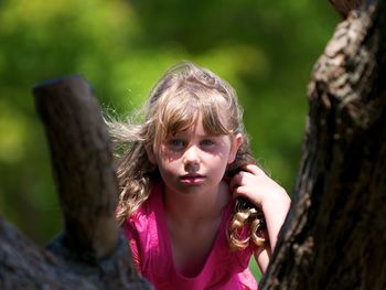 Close-up of girl with tree