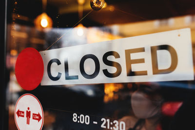 Signboard with closed text at the cafe through glass window. high quality photo