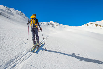 Girl makes ski mountaineering, randonnee ski trails