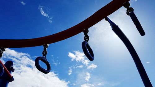 Low angle view of hanging against sky