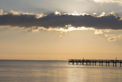 Scenic view of sea against sky at sunset