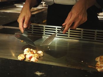 Midsection of man preparing food