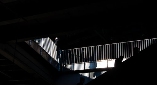 Low angle view of silhouette person on staircase