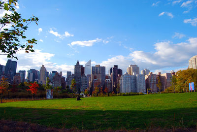 City skyline against cloudy sky