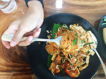 High angle view of person preparing food on table