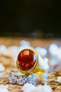 Close-up of wedding rings on table