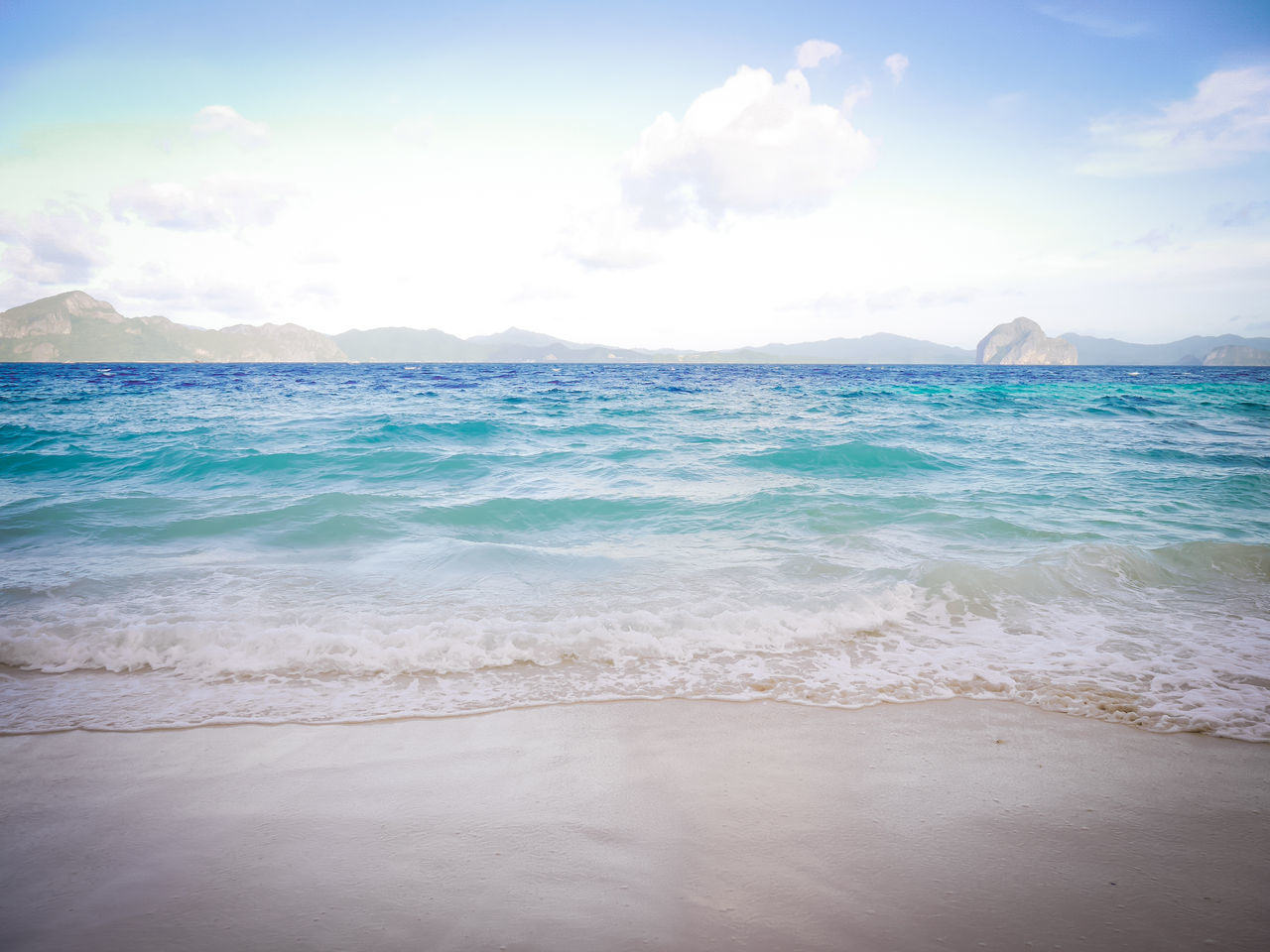 sea, water, beach, land, beauty in nature, scenics - nature, sky, tranquility, tranquil scene, cloud - sky, idyllic, nature, horizon, no people, sand, day, non-urban scene, horizon over water, motion, outdoors, turquoise colored