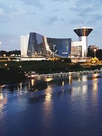 Bridge over river with city in background