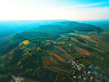 Aerial view of agricultural landscape against sky