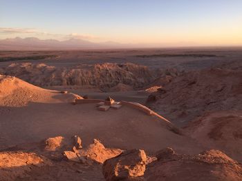 Aerial view of desert against sky during sunset