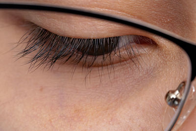 Close-up of girl face wearing eyeglasses