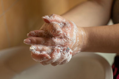 Close-up of person hand holding crystal ball