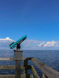 Scenic view of sea against blue sky