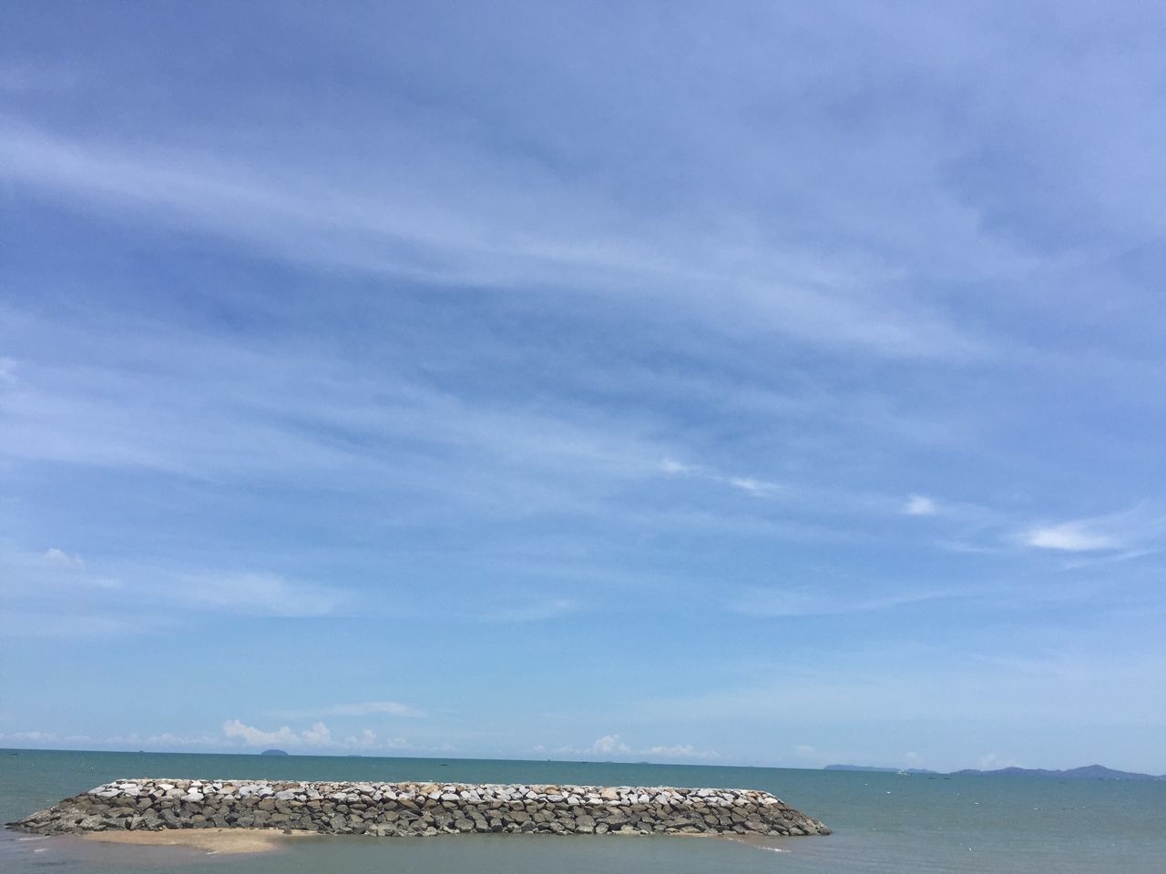 sea, water, sky, horizon over water, beach, tranquil scene, tranquility, scenics, beauty in nature, blue, nature, shore, cloud - sky, idyllic, day, cloud, outdoors, sand, no people, coastline