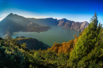 High angle view of mountain range against blue sky