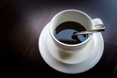 High angle view of coffee cup on table